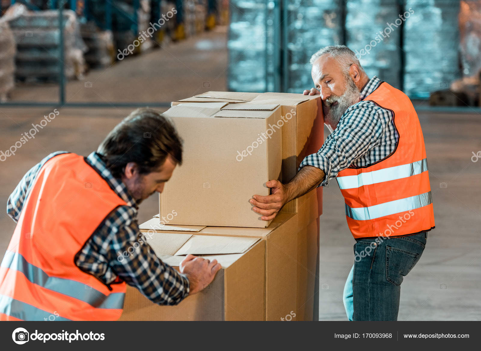 Warehouse workers moving boxes — Stock Photo © alebloshka 170093968