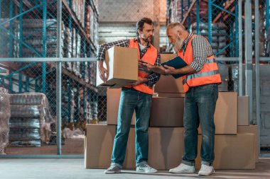 warehouse workers with clipboard  clipart