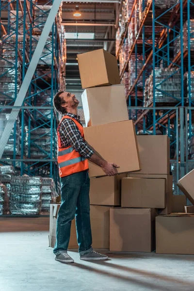 Warehouse worker with boxes — Stock Photo, Image