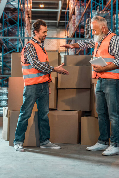 warehouse workers with digital tablet