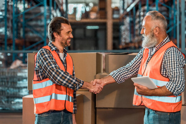 warehouse workers with digital tablet