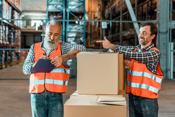 warehouse workers with clipboard
