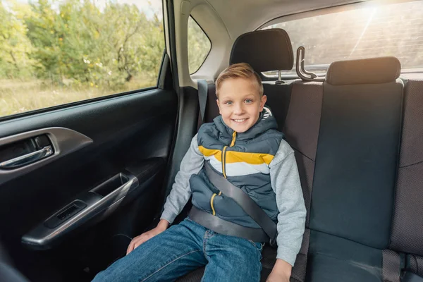 Happy little boy in car — Stock Photo, Image