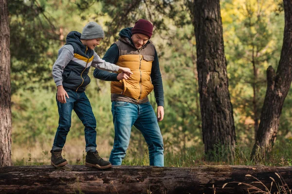 Father and son walking in forest — Stock Photo, Image