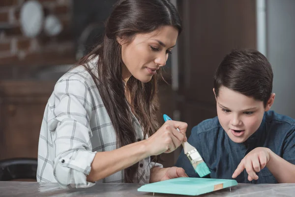 Family painting wooden school project — Stock Photo, Image