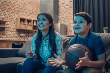 Excited family watching basketball clipart