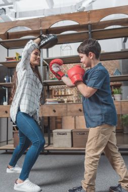 Mother and son practice boxing clipart