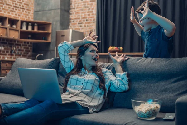 Boy scaring mother — Stock Photo, Image