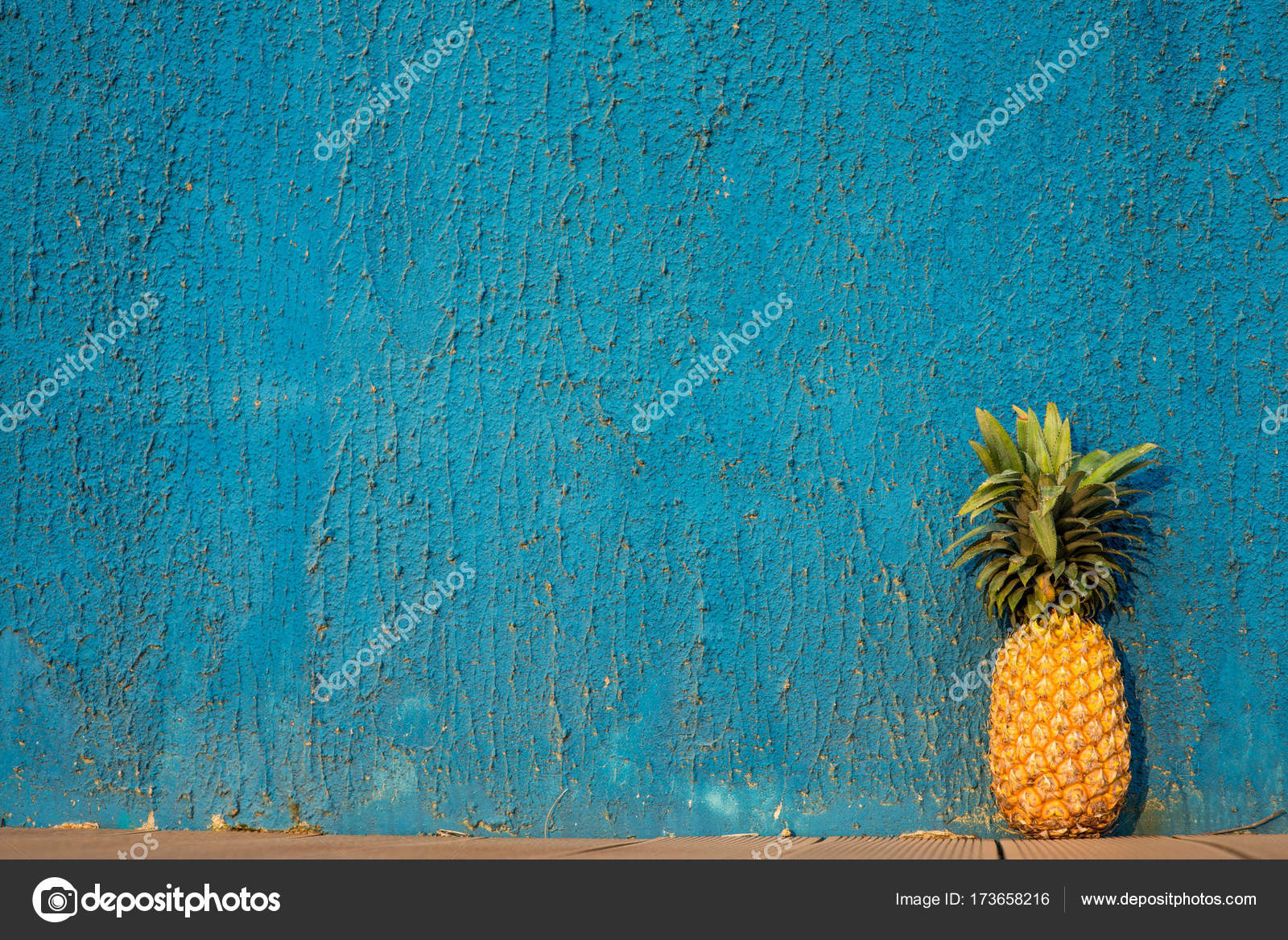 Pineapple in front of blue wall — Stock Photo © alebloshka 173658216