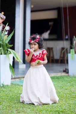 sri lankan child in traditional dress clipart