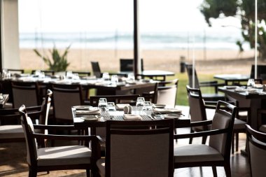 empty restaurant with served tables clipart