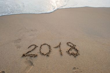 2018 sign on sandy beach clipart