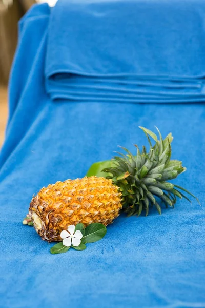 Pineapple on blue towel — Stock Photo, Image