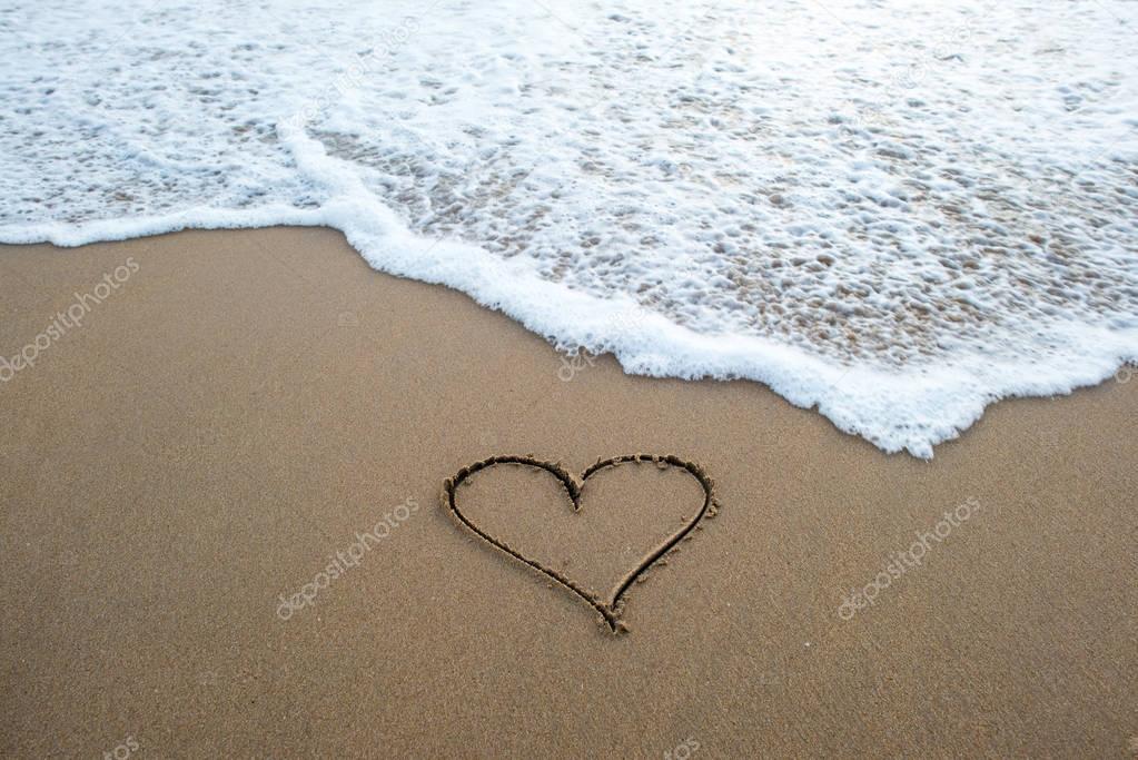 heart shape sign on sand