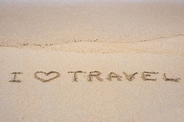 i love travel sign on sand