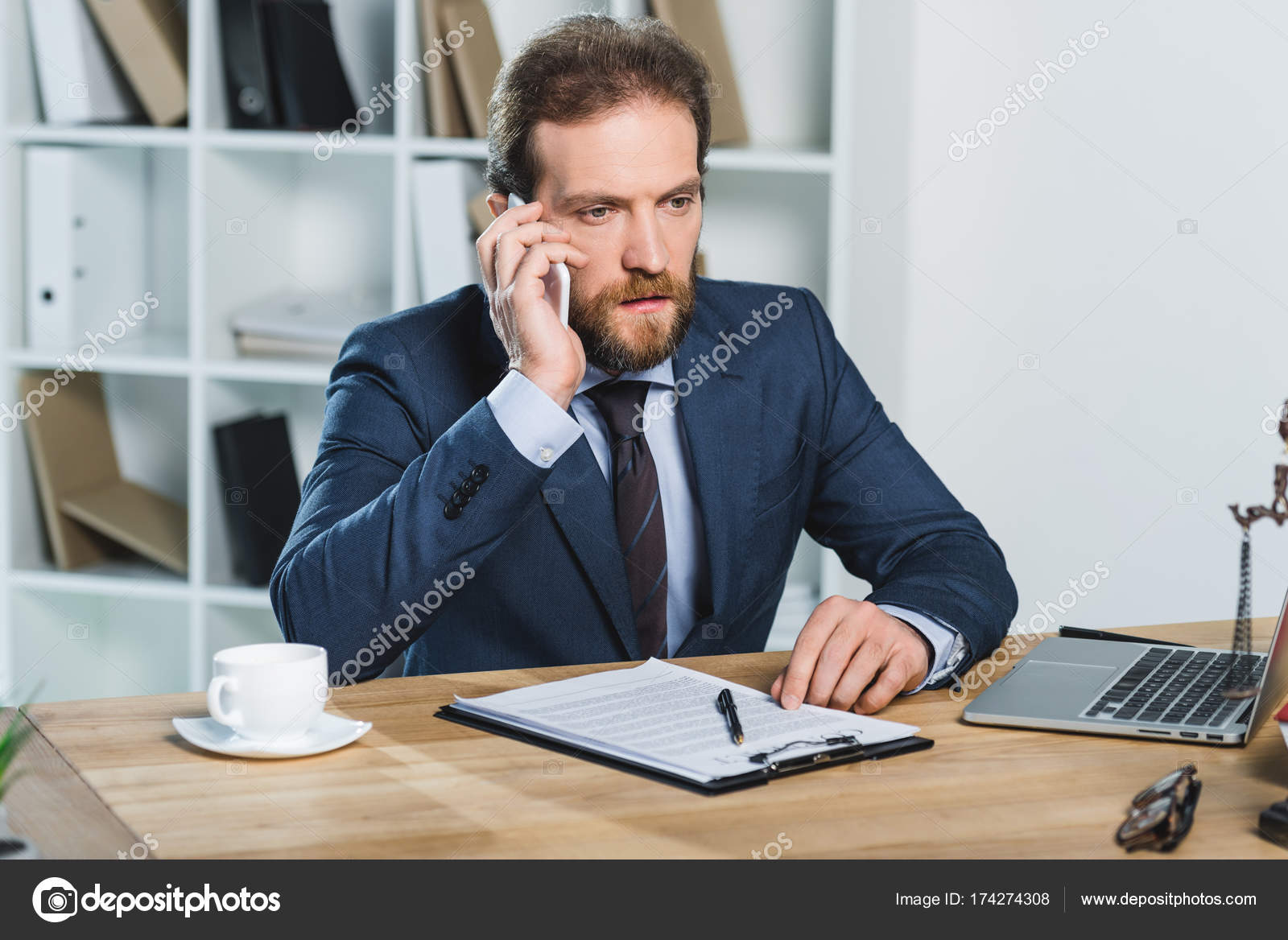 Lawyer talking on smartphone at workspace — Stock Photo © alebloshka  #174274308