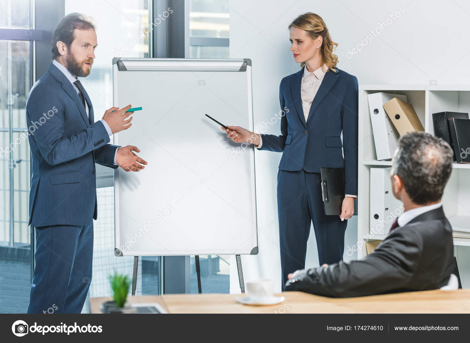 Lawyers pointing at white board Stock Photo by ©alebloshka 174274610