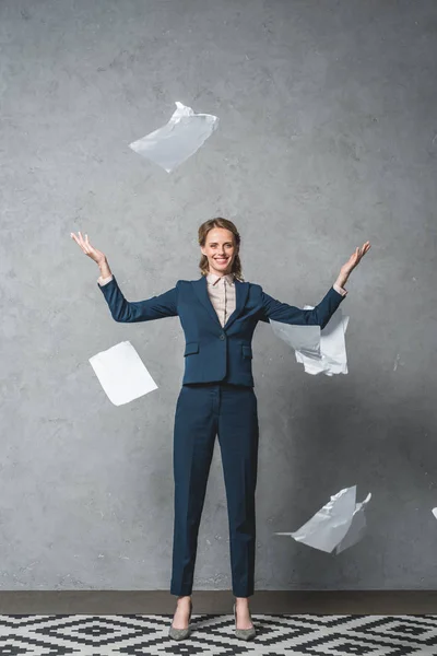 Businesswoman throwing documents — Stock Photo, Image