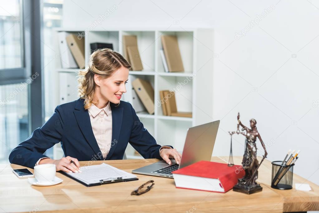 lawyer with laptop at workplace