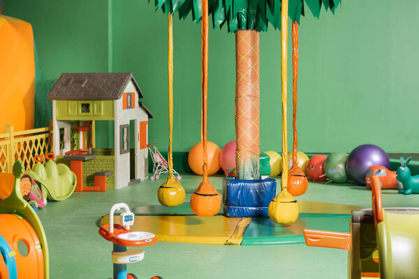 swings and colorful toys in entertainment center