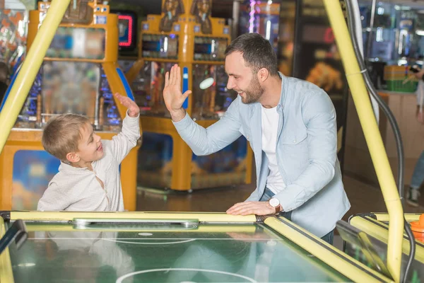 Happy Father Son Giving High Five While Playing Air Hockey — Stock Photo, Image