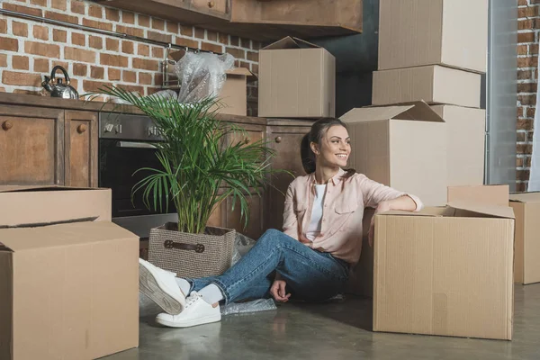 Happy Young Woman Smiling Looking Away While Sitting Cardboard Boxes — Stock Photo, Image