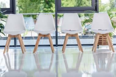 White chairs in light modern office clipart