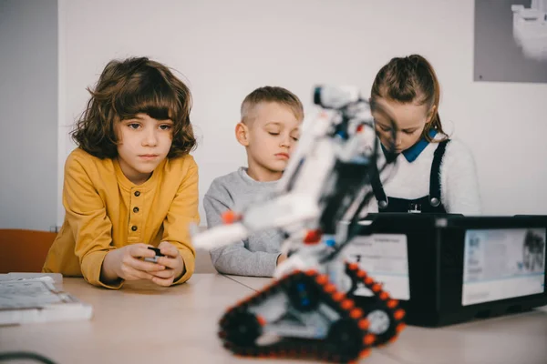 Focused Teen Kids Constructing Diy Robot Stem Education Concept Stock Image