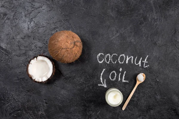 Coconut oil and nut — Stock Photo