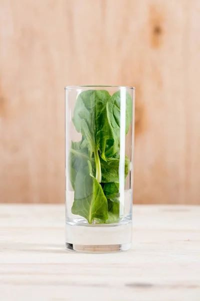 Spinach leaves in glass — Stock Photo