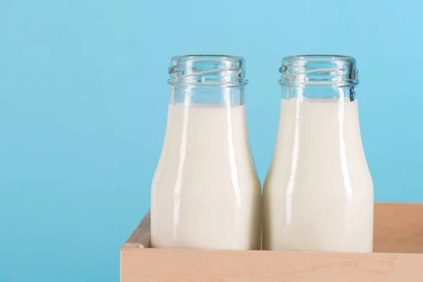 Milk in glass bottles — Stock Photo