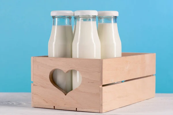 Milk in glass bottles — Stock Photo