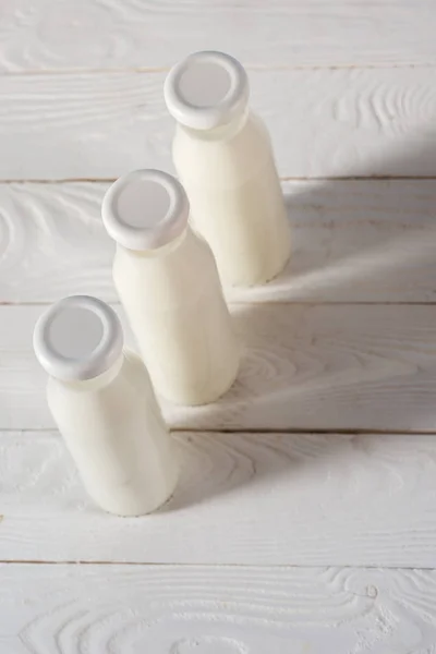 Milk in glass bottles — Stock Photo