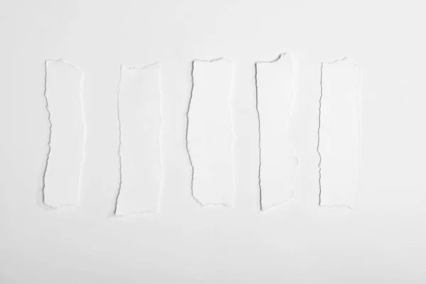 Torn empty white papers — Stock Photo