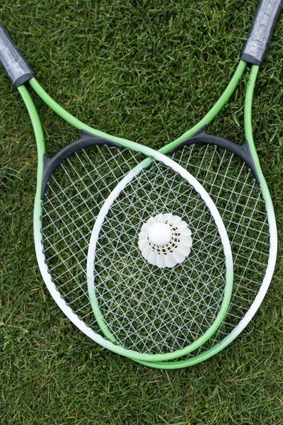 Shuttlecock on badminton rackets — Stock Photo