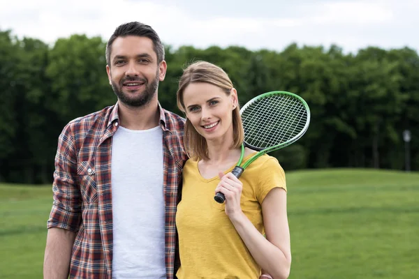 Couple with badminton racquet — Stock Photo