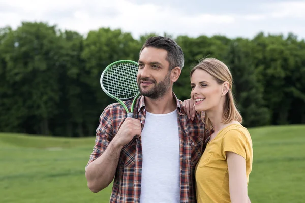 Couple with badminton racquet — Stock Photo