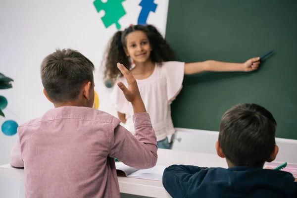 Schoolkids studying in classroom — Stock Photo