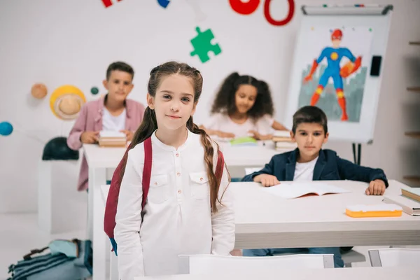 Schoolkids studying in classroom — Stock Photo