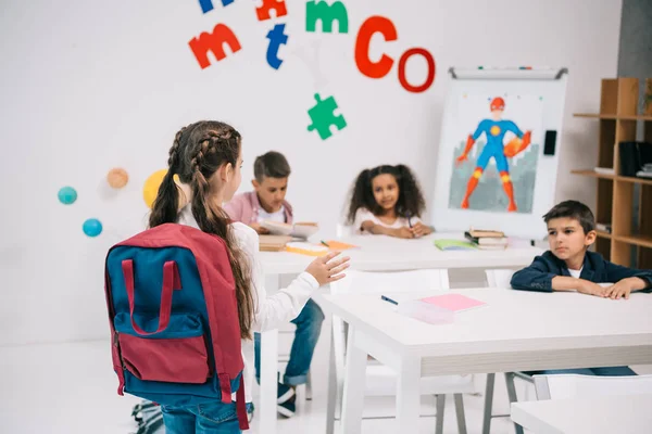 Schoolkids studying in classroom — Stock Photo