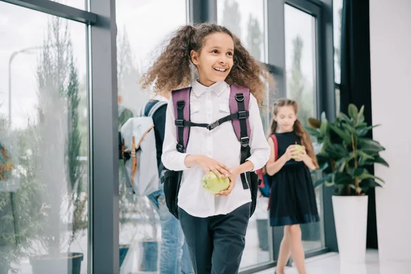 Pupil with apple at break — Stock Photo