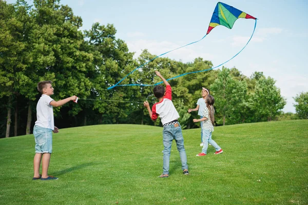 Children playing with kite — Stock Photo