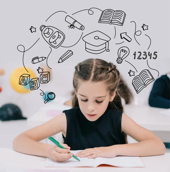 Schoolgirl studying in classroom — Stock Photo