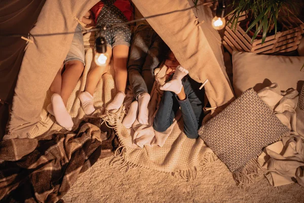 Children resting in tent at home — Stock Photo