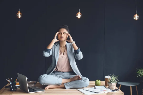 African american businesswoman mediating in office — Stock Photo