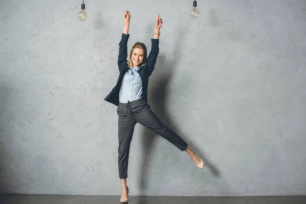 Happy businesswoman in suit — Stock Photo