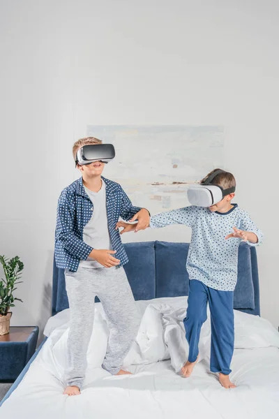 Boys in virtual reality headsets — Stock Photo