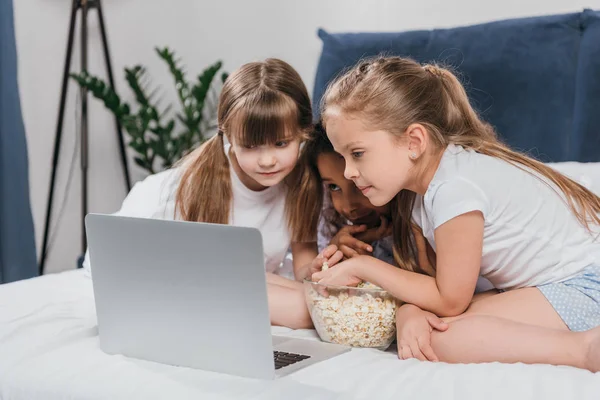 Multiethnic girls using laptop — Stock Photo