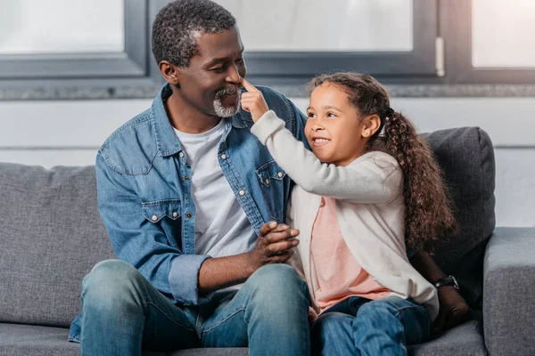 African american girl with father at home — Stock Photo