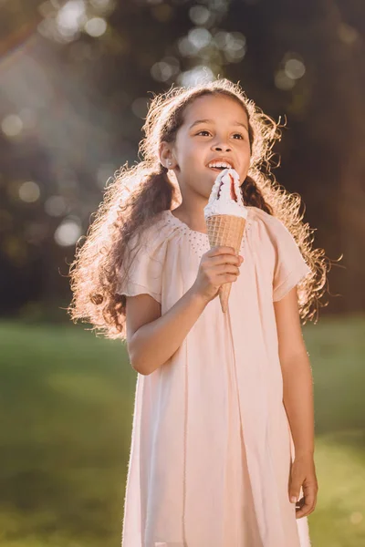 Girl eating ice cream — Stock Photo